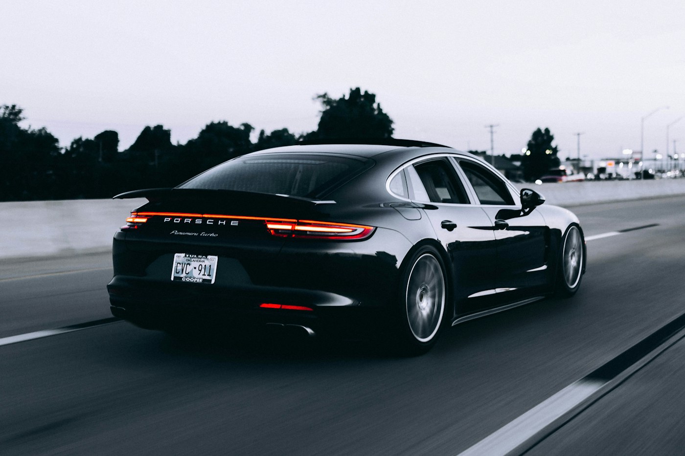 Dark road car travelling on a highway